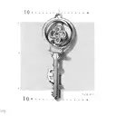 a scale with the shape of a key tattoo design idea
