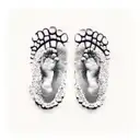 baby footprint with the name Adele on top of it tattoo design idea