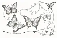 a tramp stamp tattoo consisting hearts or butterfly's with an edgy but modern look  tattoo design idea