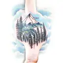 forearm tattoo with the ocean, forest, mountains, and sunset with clouds tattoo design idea