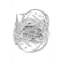 A detailed illustration of a horseshoe with intricate patterns and a farm landscape inside tattoo design idea