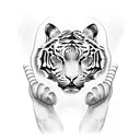 A boxing glove morphing into a fierce tiger, symbolizing strength and power tattoo design idea