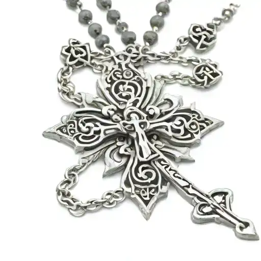 rosary cross necklace hanging off soemthing tattoo design idea