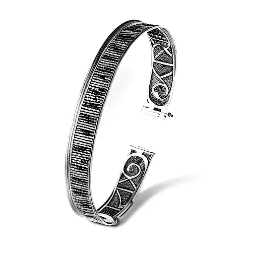 a bangle with piano keys on it tattoo design idea