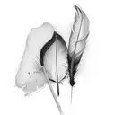 single black feather with white spot tattoo design idea