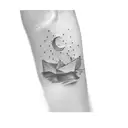 a paper boat tattoo design idea
