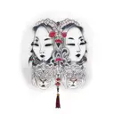 attractive fem twins (red head and brunette) holding hands. one holds a chain with a lion and the other an antique scale tattoo design idea