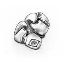 two small boxing gloves tattoo design idea