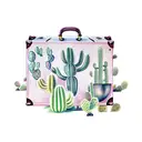 A vintage suitcase surrounded by cacti and vineyard grapes tattoo design idea