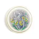 pocket watch surrounded by daffodils tattoo design idea