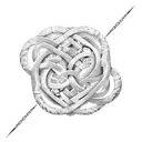 An intricate infinity symbol intertwined with a delicate scale representing balance, in a blackwork style tattoo design idea