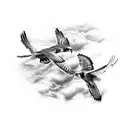 Realistic tattoo of two red tail hawks fighting while in flight. One hawk is diving at the other with talons extended tattoo design idea