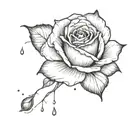 A delicate raindrop falling from a dark cloud onto a single rose petal tattoo design idea