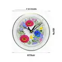 border year clock in a glas cuple standing on a tablewhit flowers around in memory  tattoo design idea