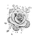 A flower garden growing out of an open book, with coffee beans sprinkled among the petals tattoo design idea