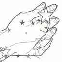a small star on the wrist with sparkles tattoo design idea