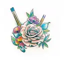 paint brushes and pencils with little flowers or tied up with plants tattoo design idea