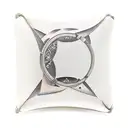 Rectangular leather label with side seams, hanging with a string on one side. inside the label it says: momomomomo tattoo design idea