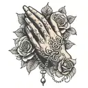 praying hands holding rosary surrounded by roses tattoo design idea