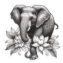 elephant and lotus flower surrounded tattoo design idea